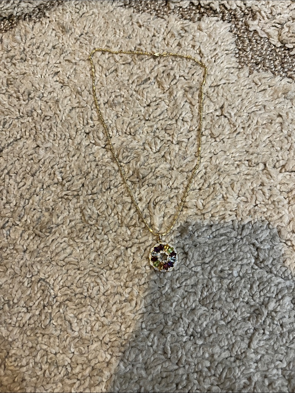 Gemstone pin wheel pendant.